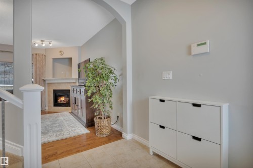 123 89 Rue Monette, Beaumont, AB - Indoor Photo Showing Other Room With Fireplace