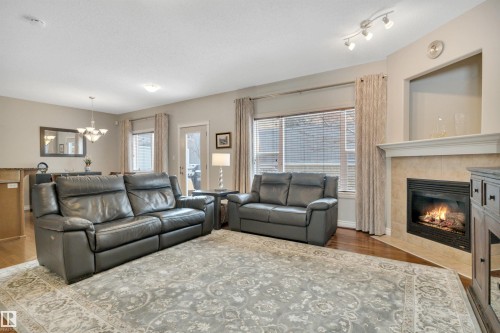 123 89 Rue Monette, Beaumont, AB - Indoor Photo Showing Living Room With Fireplace