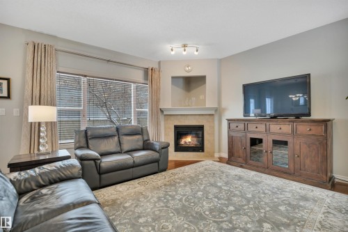 123 89 Rue Monette, Beaumont, AB - Indoor Photo Showing Living Room With Fireplace