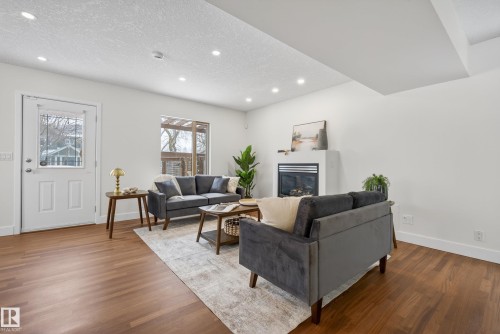 8860 93 Street, Edmonton, AB - Indoor Photo Showing Living Room With Fireplace