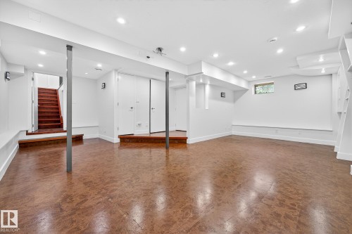 Basement features cork flooring and a 3rd fireplace. Previous owners have made this a theatre room. - 8860 93 Street, Edmonton, AB - Indoor Photo Showing Other Room