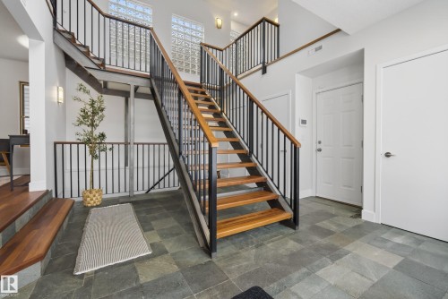 These Brazilian hardwood stairs are a showstopper!! - 8860 93 Street, Edmonton, AB - Indoor Photo Showing Other Room