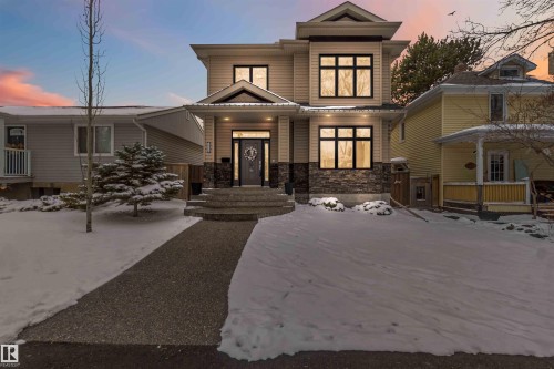 Contemporary facade with multi-level rooflines and neutral siding - 10630 82 Street, Edmonton, AB - Outdoor With Facade