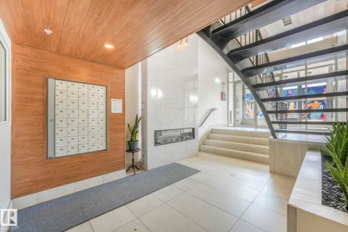 Common area with stairs, wood ceiling, and recessed lighting - 310 10606 102 Avenue, Edmonton, AB - Indoor Photo Showing Other Room