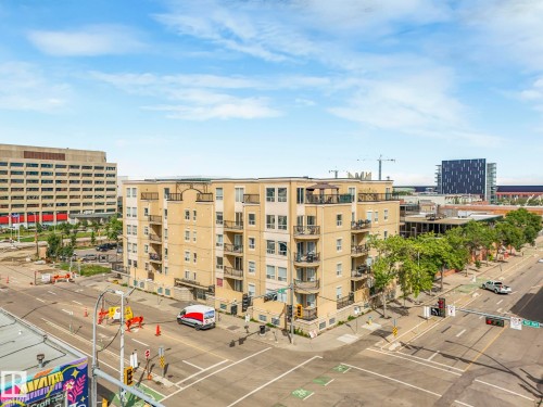 View of apartment building / complex featuring uncovered parking - 310 10606 102 Avenue, Edmonton, AB - Outdoor With Balcony With View