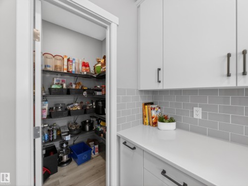 Kitchen pantry featuring extensive wire shelving - 323 Balsam Link, Leduc, AB - Indoor Photo Showing Kitchen