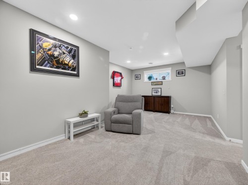 Carpeted lower-level room featuring recessed lighting, light gray walls, white trim, and a window opening - 323 Balsam Link, Leduc, AB - Indoor