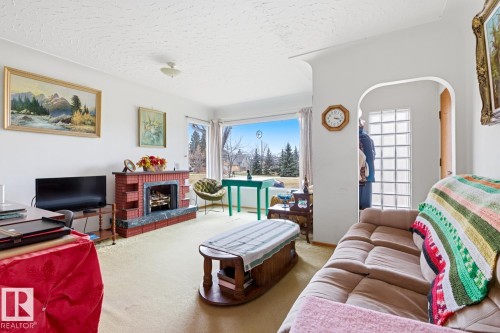 9745 68 Avenue, Edmonton, AB - Indoor Photo Showing Other Room With Fireplace