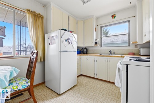 9745 68 Avenue, Edmonton, AB - Indoor Photo Showing Kitchen With Double Sink
