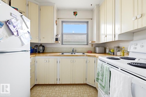 9745 68 Avenue, Edmonton, AB - Indoor Photo Showing Kitchen With Double Sink