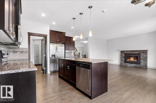 5912 19 Avenue, Edmonton, AB - Indoor Photo Showing Kitchen With Fireplace With Stainless Steel Kitchen With Upgraded Kitchen
