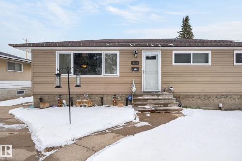 Tan horizontal siding exterior with a brown shingled roof - 9112 130 Avenue, Edmonton, AB - Outdoor