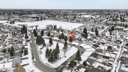 Residential neighborhood featuring a curvilinear street layout and numerous mature trees - 9112 130 Avenue, Edmonton, AB - Outdoor With View