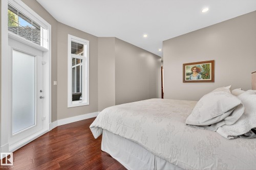 Bedroom with recessed lighting and dark wood-type flooring - 940 Haliburton Road, Edmonton, AB - Indoor Photo Showing Bedroom