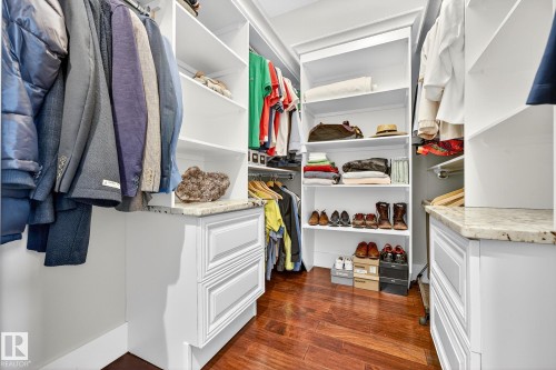 Walk in closet with dark wood-style flooring - 940 Haliburton Road, Edmonton, AB - Indoor With Storage