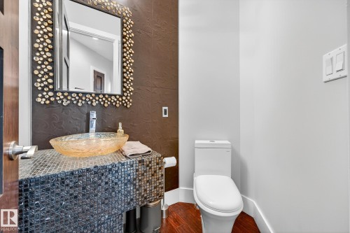 Bathroom with wood finished floors and vanity - 940 Haliburton Road, Edmonton, AB - Indoor Photo Showing Bathroom