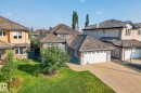 Traditional-style home featuring stucco siding, stone siding, driveway, and a residential view - 940 Haliburton Road, Edmonton, AB  - Outdoor 