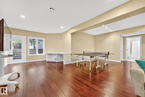 Recreation room with dark wood-style floors and recessed lighting - 940 Haliburton Road, Edmonton, AB - Indoor