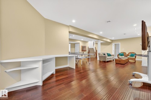 Living area featuring stairway, dark wood-style flooring, and recessed lighting - 940 Haliburton Road, Edmonton, AB - Indoor Photo Showing Other Room