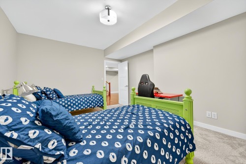 Carpeted bedroom with baseboards - 940 Haliburton Road, Edmonton, AB - Indoor Photo Showing Bedroom