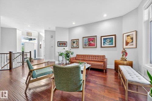 Living room featuring dark wood-style flooring and recessed lighting - 940 Haliburton Road, Edmonton, AB - Indoor