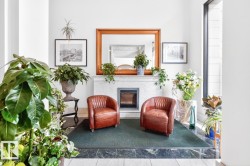 Marble tile flooring with a dark green accent border - 