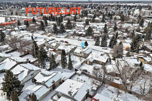 Aerial view of the neighborhood showcasing numerous properties with snow-covered roofs and mature trees - 8733 181A Street Nw, Edmonton, AB - Outdoor With View