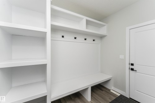 Custom built-in storage unit featuring white cabinetry and shelving - 5386 Kimball Place, Edmonton, AB - Indoor Photo Showing Other Room