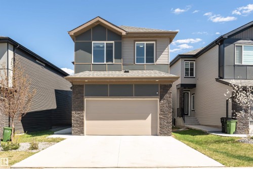 Modern two-story residence featuring a combination of horizontal siding and stacked stone accents - 5386 Kimball Place, Edmonton, AB - Outdoor