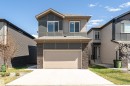Modern two-story residence featuring a combination of horizontal siding and stacked stone accents - 5386 Kimball Place, Edmonton, AB  - Outdoor 