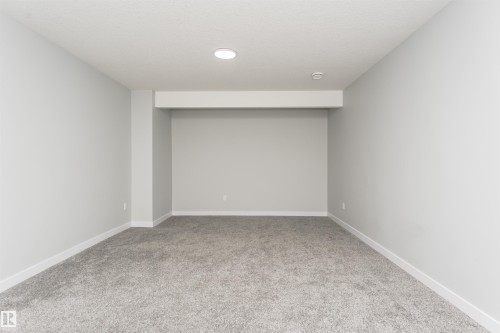 Carpeted interior space featuring light gray walls and white trim - 5386 Kimball Place, Edmonton, AB - Indoor Photo Showing Other Room