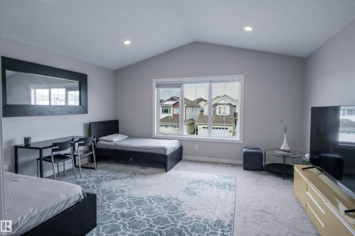 Carpeted room featuring a vaulted ceiling and recessed lighting - 1728 53 Street, Edmonton, AB - Indoor