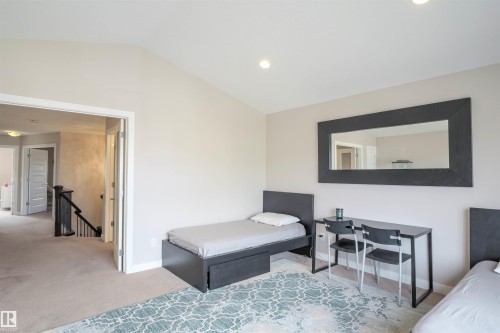 Carpeted room with a vaulted ceiling and recessed lighting - 1728 53 Street, Edmonton, AB - Indoor