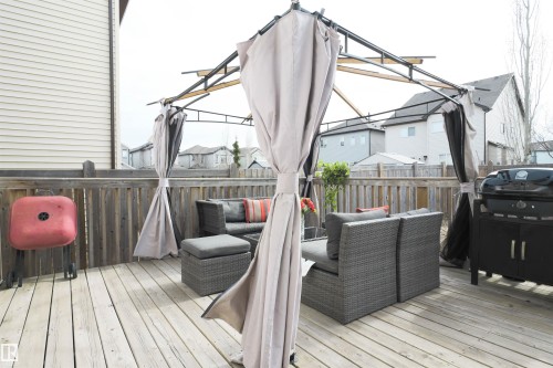 Spacious outdoor deck featuring light wood decking and a privacy fence - 1728 53 Street, Edmonton, AB - Outdoor With Deck Patio Veranda With Exterior