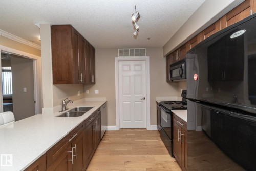 209 13111 140 Avenue, Edmonton, AB - Indoor Photo Showing Kitchen With Double Sink