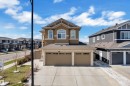 Stucco exterior with stone accents, featuring a two-car garage - 1404 25 Street, Edmonton, AB  - Outdoor With Facade 