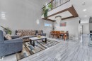 Expansive main living area featuring high ceilings and large format tile flooring - 1404 25 Street, Edmonton, AB  - Indoor Photo Showing Living Room 