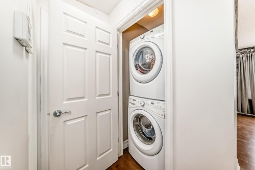 Dedicated laundry closet featuring a stackable washer and dryer unit - 69 3625 144 Avenue, Edmonton, AB - Indoor Photo Showing Laundry Room