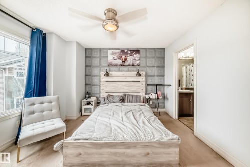 Bedroom featuring a window, ceiling fan with integrated lighting, and carpet flooring - 69 3625 144 Avenue, Edmonton, AB - Indoor Photo Showing Bedroom