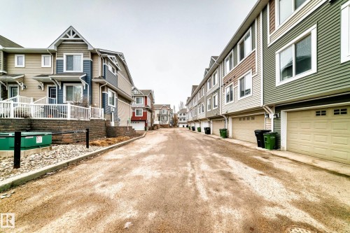 Townhome row featuring multi-level construction and varying exterior siding colors - 69 3625 144 Avenue, Edmonton, AB - Outdoor With Facade