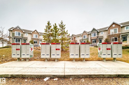 Community mailbox stations providing convenient mail access - 69 3625 144 Avenue, Edmonton, AB - Outdoor With Facade