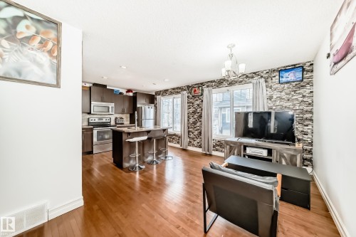Open concept living space featuring wood-finish flooring - 69 3625 144 Avenue, Edmonton, AB - Indoor
