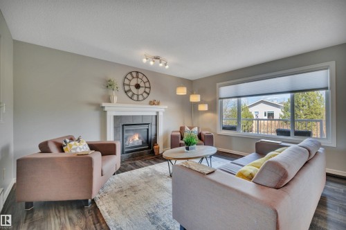 110 Windrose Drive, Leduc, AB - Indoor Photo Showing Living Room With Fireplace