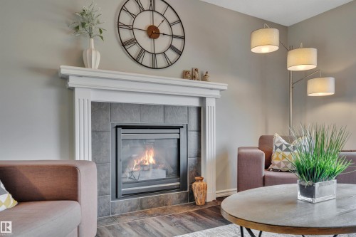 110 Windrose Drive, Leduc, AB - Indoor Photo Showing Living Room With Fireplace