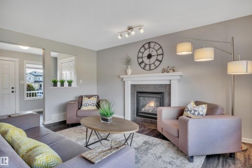 110 Windrose Drive, Leduc, AB - Indoor Photo Showing Living Room With Fireplace