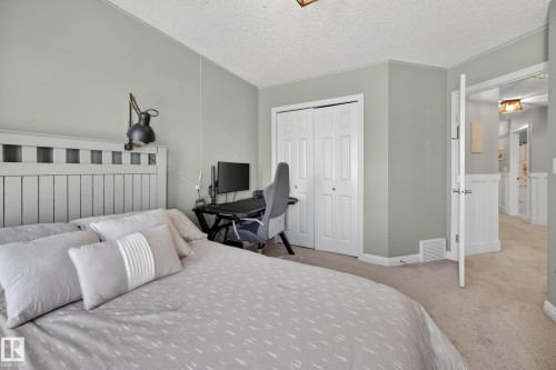 Bedroom featuring light walls and neutral carpeting - 1110 Armitage Crescent, Edmonton, AB - Indoor Photo Showing Bedroom