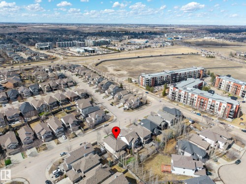 Aerial perspective showcasing a residential neighborhood with detached homes and multi-story apartment buildings - 1110 Armitage Crescent, Edmonton, AB - Outdoor With View