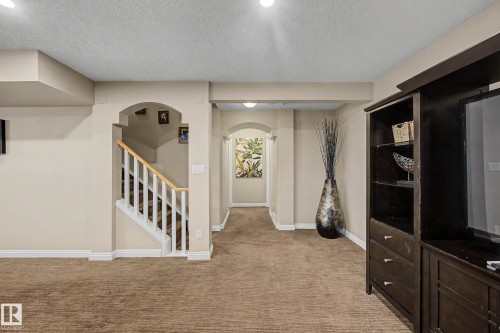Finished lower-level space featuring carpet flooring and recessed lighting - 1110 Armitage Crescent, Edmonton, AB 