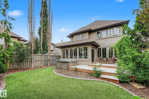 Expansive backyard featuring a multi-tiered wood deck and integrated hot tub - 1110 Armitage Crescent, Edmonton, AB 