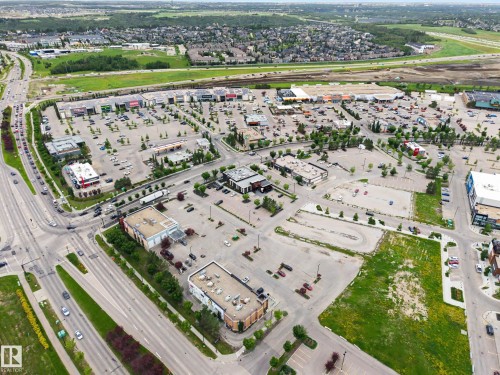 Aerial perspective showcasing a commercial development with multiple retail buildings - 1110 Armitage Crescent, Edmonton, AB 